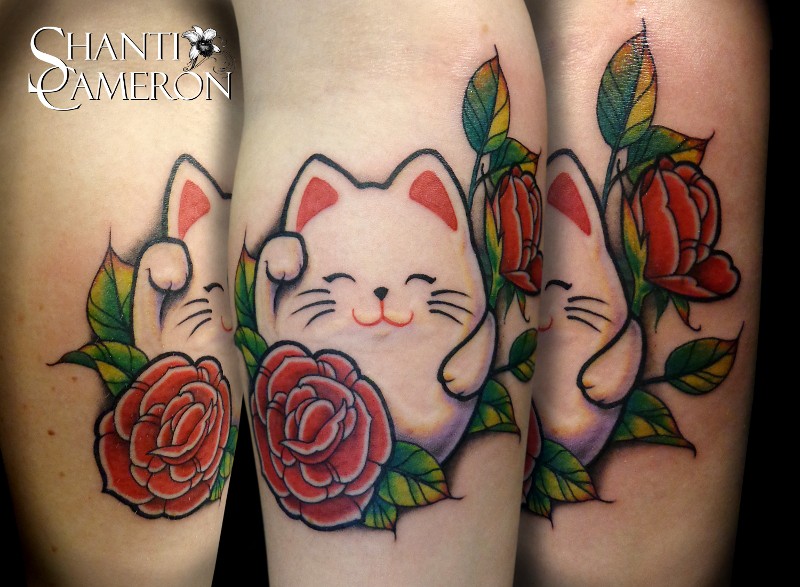 Small cartoon style colored leg tattoo of cute maneki neko japanese lucky cat with rose