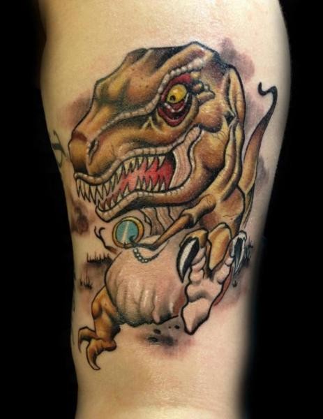 Small cartoon style interesting looking dinosaur tattoo on leg