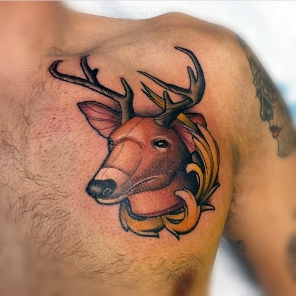 Small colored chest tattoo of illustrative deer head