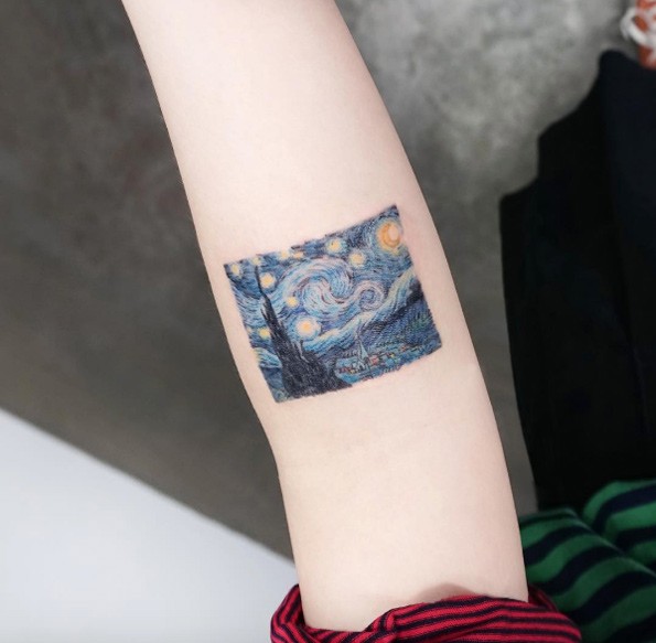 Small cool looking colored arm tattoo of castle with night sky and stars