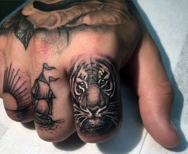 Small cute colored finger tattoo of tiger head