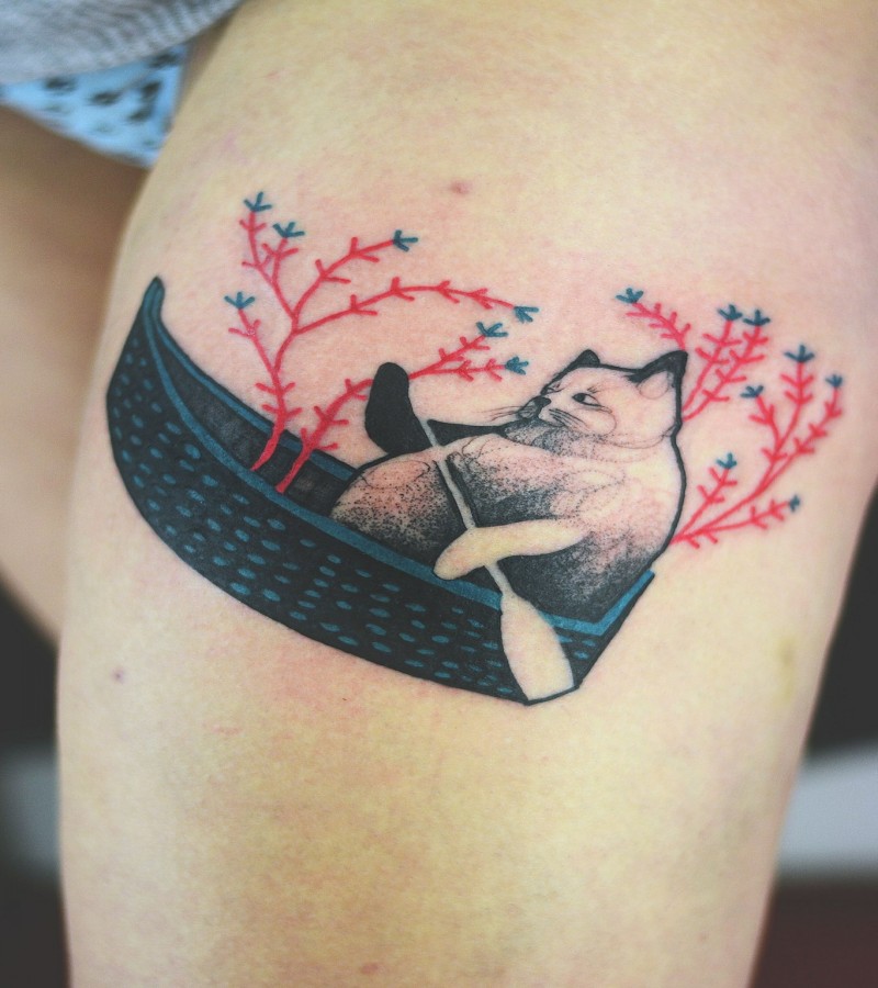 Small cute looking colored by Joanna Swirska tattoo of cat in boat