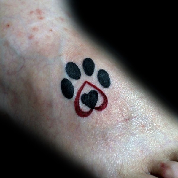 Small cute looking foot tattoo of animal paw print