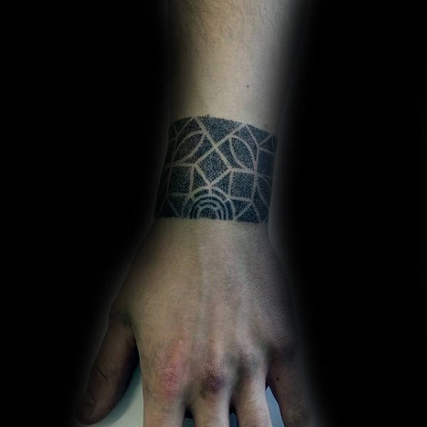 Small dotwork style tattoo of simple wrist band