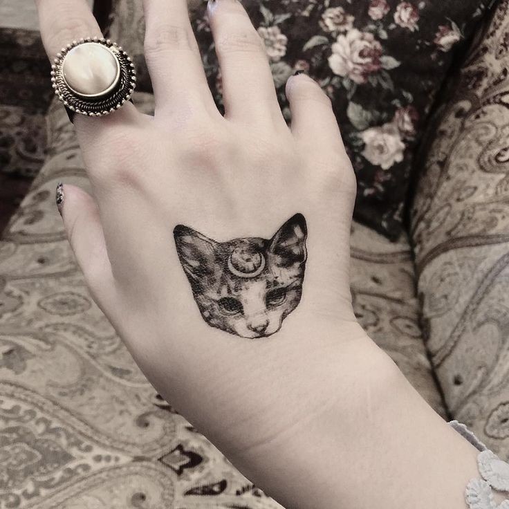 Small for girls like black and white hand tattoo of fantasy cat with moon symbol