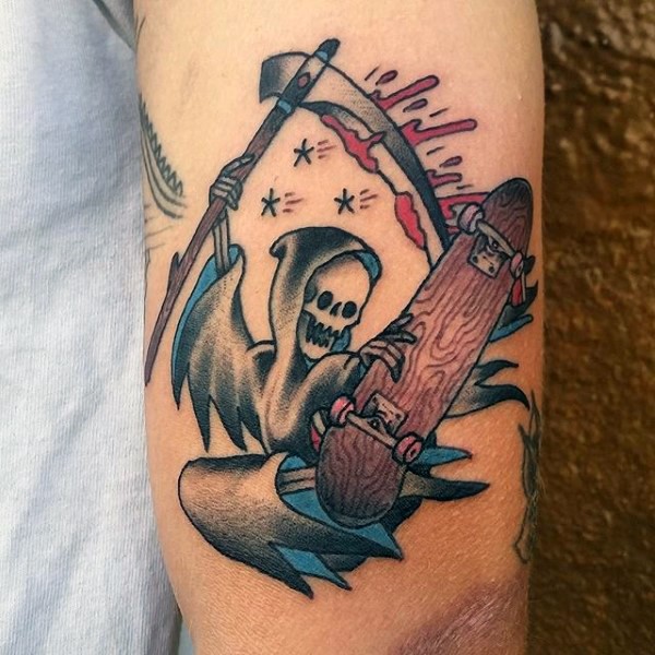 Small funny looking old school Death skater tattoo on arm