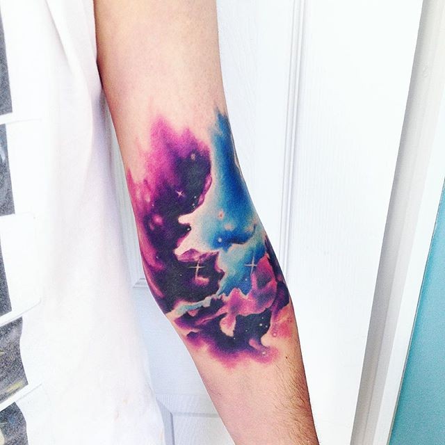 Small illustrative style colored forearm tattoo of night sky