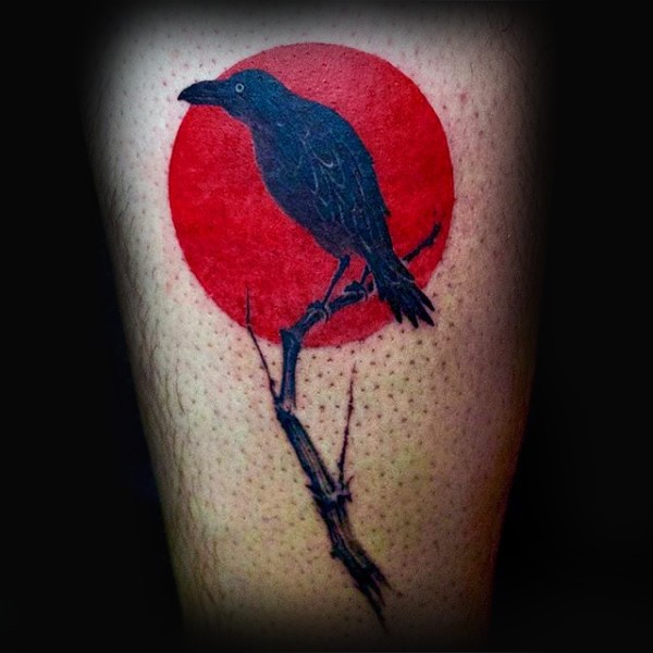 Small illustrative style crow with tree branch tattoo