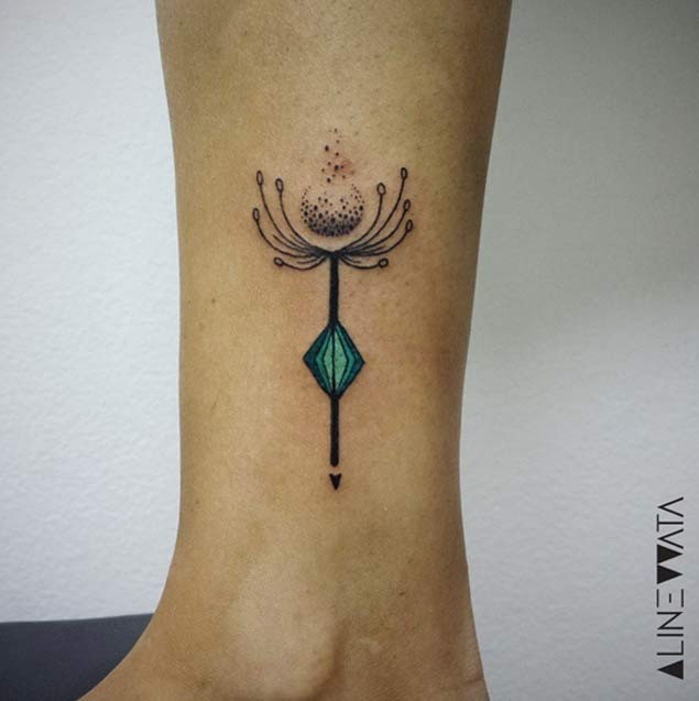 Small new school style colored flower with letter tattoo on ankle