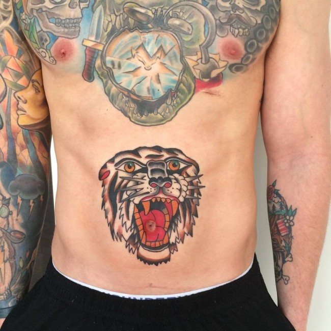 Small old school style colored belly tattoo of lion head