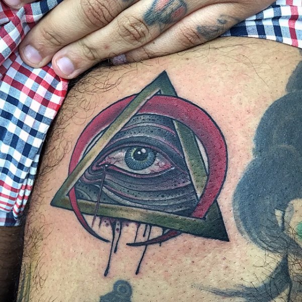 Small old school style colored mystical pyramid with red moon tattoo on thigh