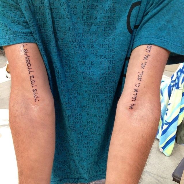 Small size black ink Arabic lettering tattoo on both arms