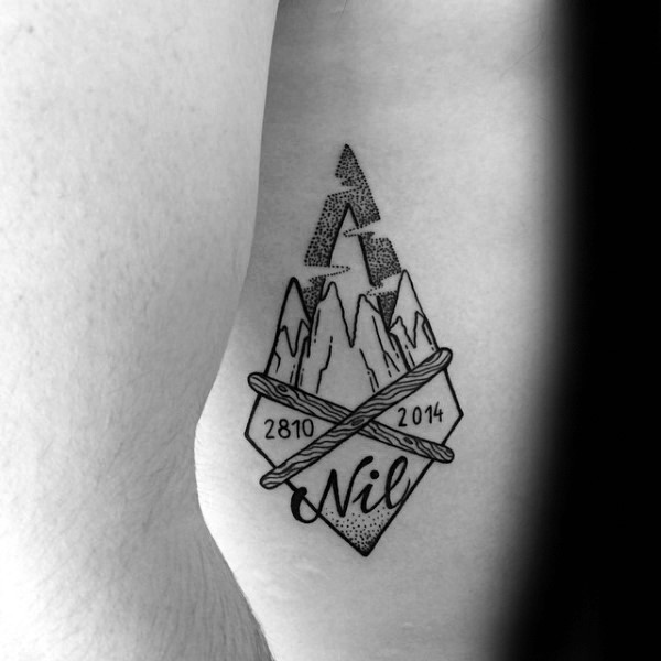 Small stippling style ancient arrow head with lettering and date