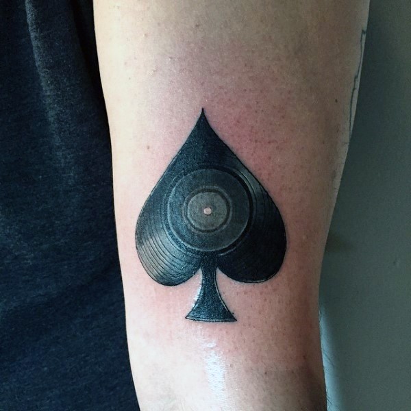 Spades symbol stylized with vinyl record original idea tattoo