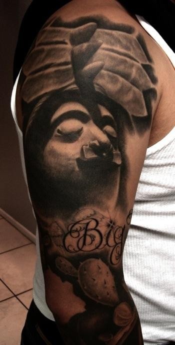 Spectacular black and white sleeve tattoo of creepy looking ancient statue with lettering