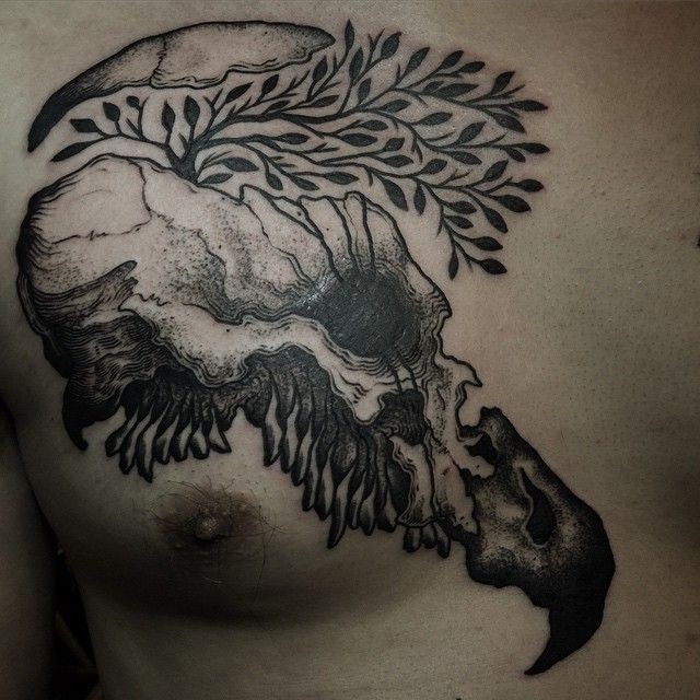 Spectacular black ink dot style chest tattoo of broken animal skull with tree