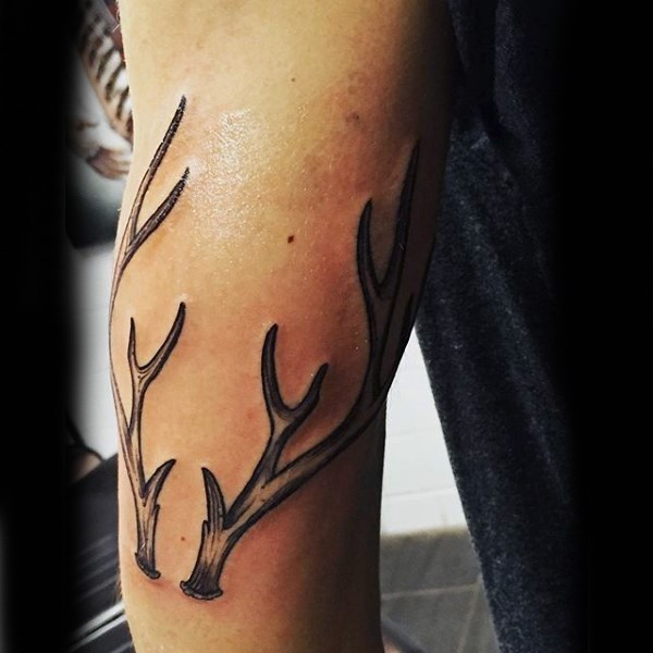 Spectacular black ink forearm tattoo of deer horns