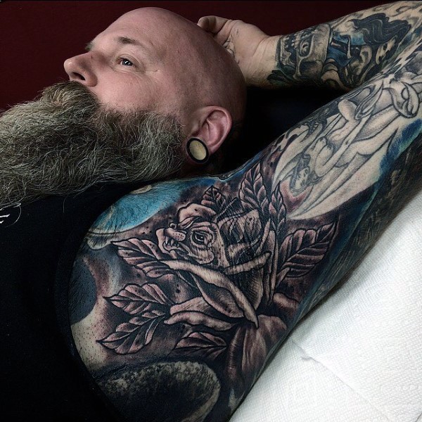 spectacular black ink side tattoo of large rose