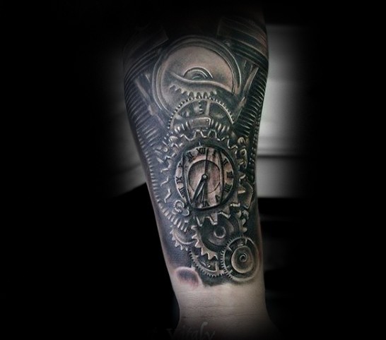 Spectacular colored engine stylized with clock tattoo on forearm