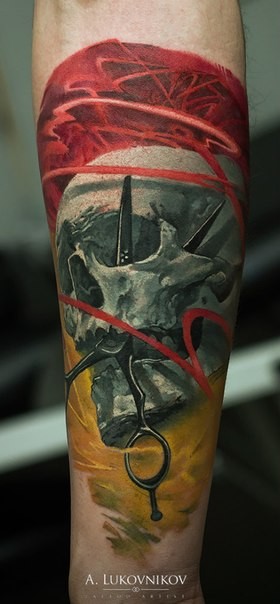Spectacular colored forearm tattoo of skull with scissors