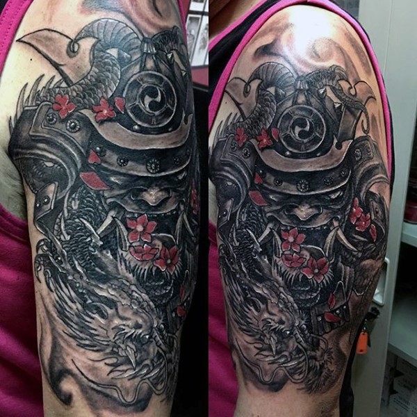 Spectacular designed and colored shoulder tattoo of samurai mask with dragon and flower