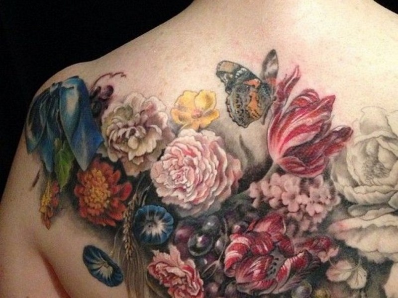 Spectacular lifelike colored various flowers tattoo on back with butterfly