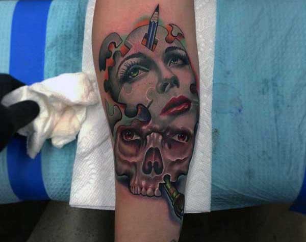 Spectacular looking colored abstract style forearm tattoo of woman mask and skull