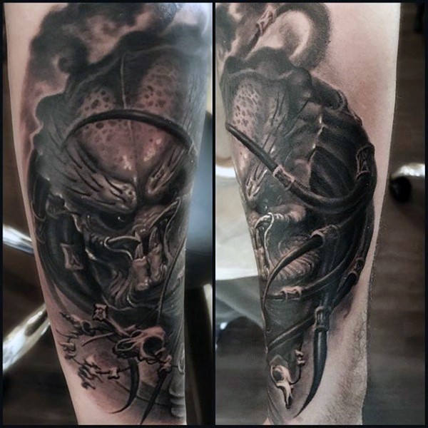 Spectacular looking colored arm tattoo of evil Predator