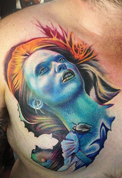 Spectacular looking colored chest tattoo of fantasy woman with bug