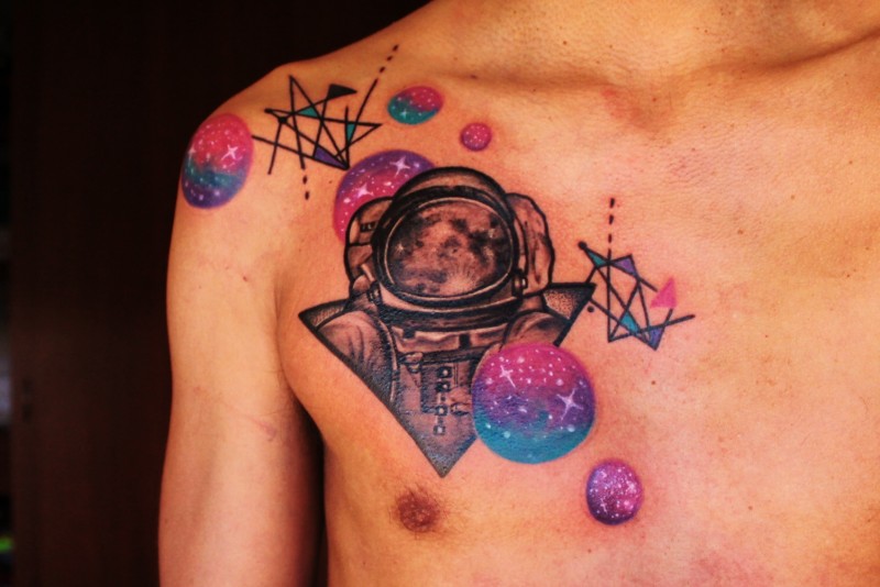 Spectacular looking colorful chest tattoo of planets with spacesuit