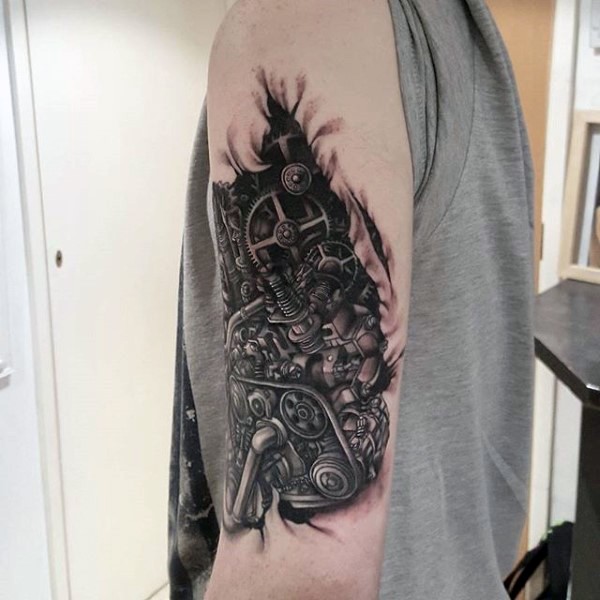 Spectacular looking realistic biomechanical style shoulder tattoo