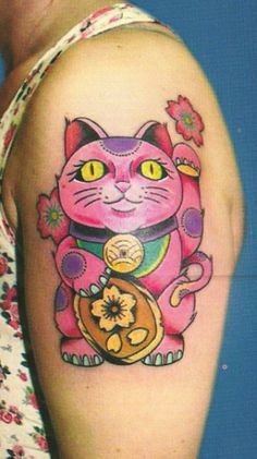 Spectacular multicolored shoulder tattoo of sweet painted maneki neko japanese lucky cat with flowers