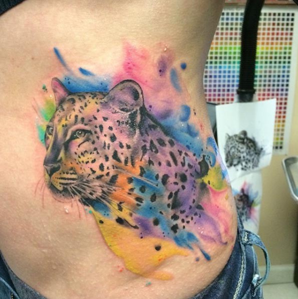Spectacular natural looking detailed cheetah tattoo on side