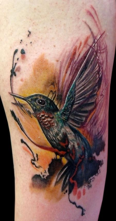 Spectacular natural looking hummingbird tattoo on arm