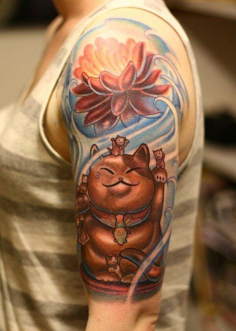 Spectacular painted and colored shoulder tattoo of maneki neko japanese lucky cat statue with big flower