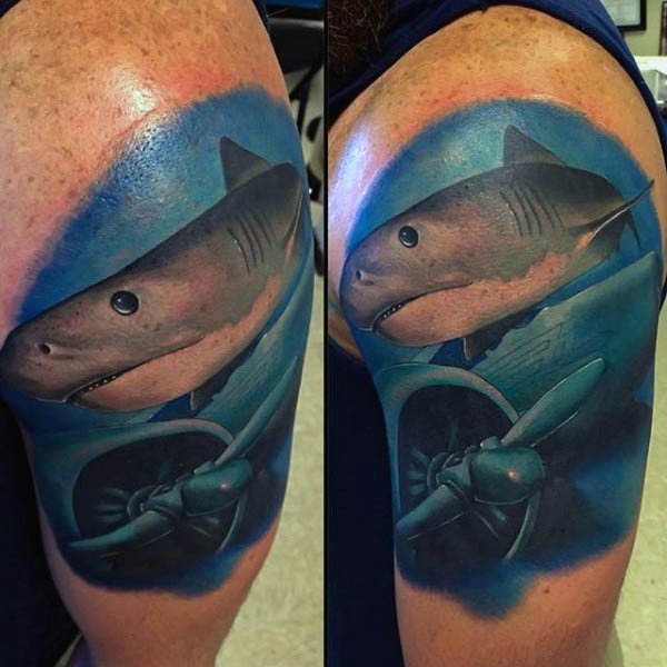 Spectacular realism style colored shoulder tattoo of drowned plane and big shark