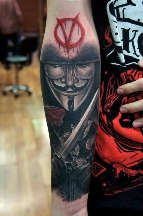 Spectacular very detailed forearm tattoo of Vendetta hero with emblem