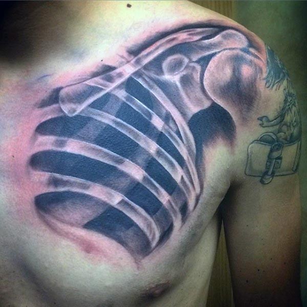 Spectacular very detailed X-Ray like colored chest tattoo of human bones