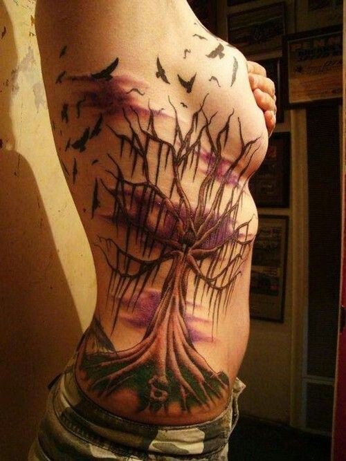 Spooky dead tree tattoo on ribs
