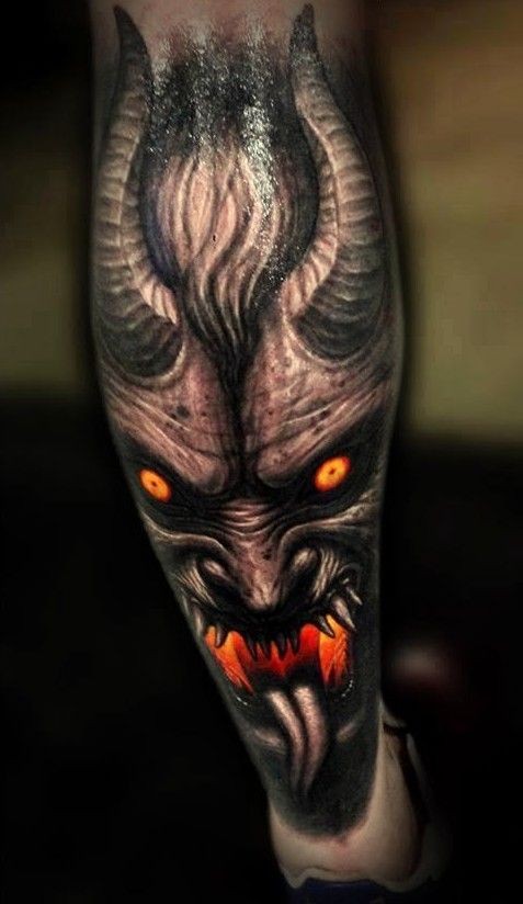 Spooky demon with red eyes tattoo