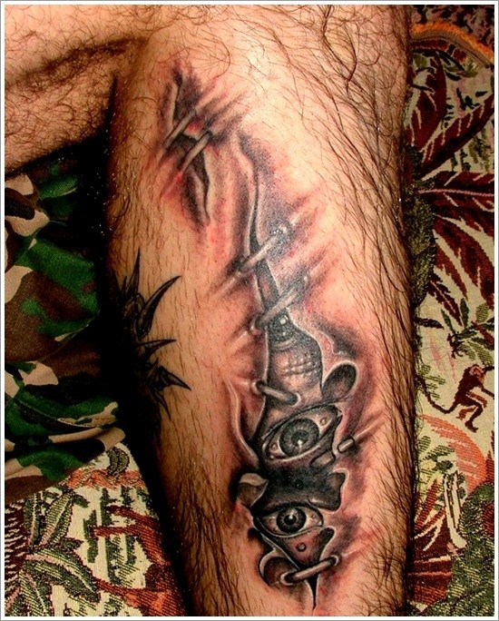 Spooky Eyes Under Skin Rip Tattoo On Leg Tattooimages Biz