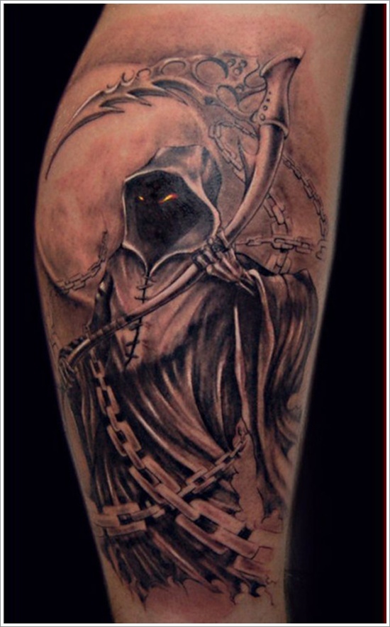 Spooky grim reaper with glowing eyes tattoo