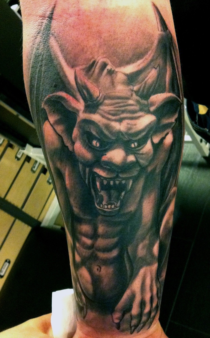 Spooky realistic gargoyle tattoo