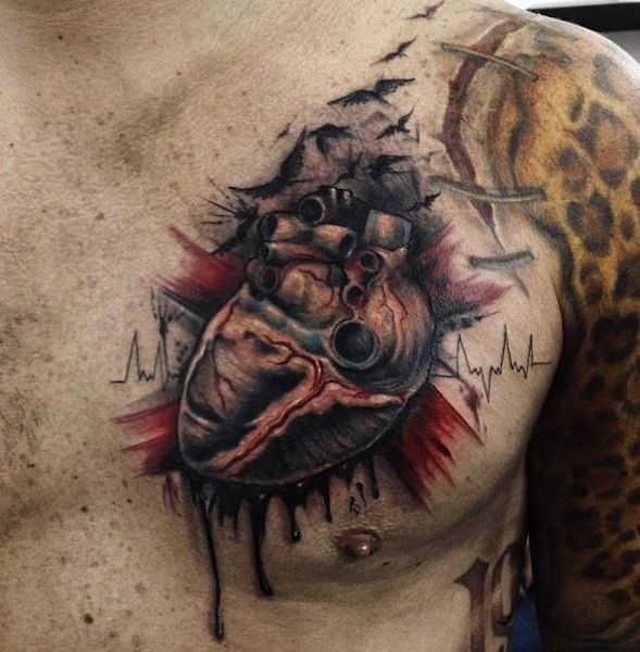 Spooky realistic heart tattoo on chest by Yomico Moreno