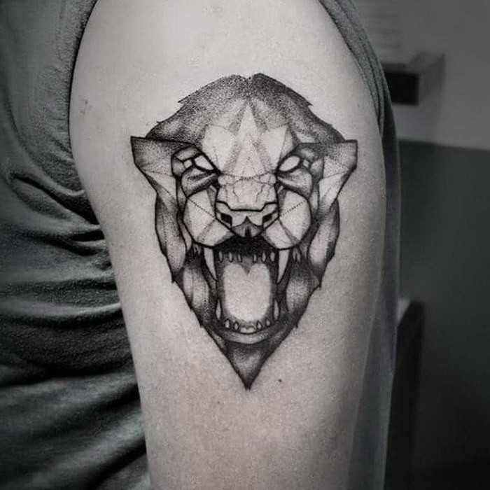 Stippling style black and white shoulder tattoo of roaring lion