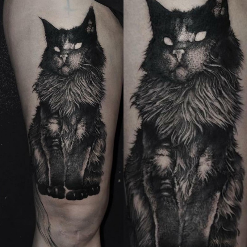 Stippling style black and white thigh tattoo of big dark cat