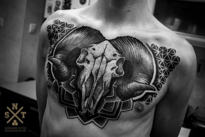 Stippling style black ink animal skull tattoo with various ornaments