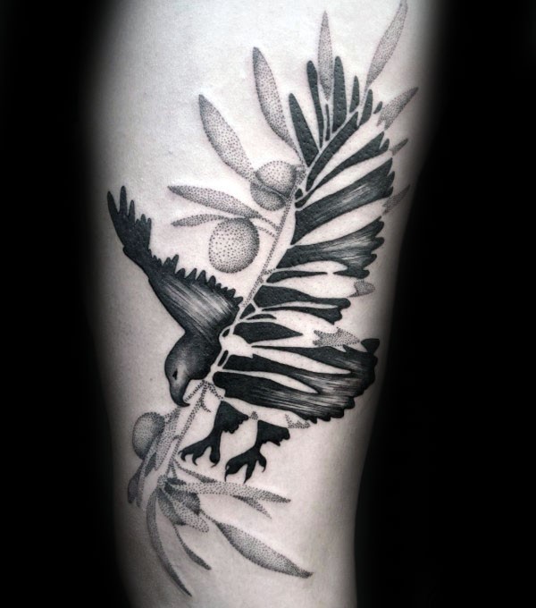 Stippling style black ink arm tattoo of bird with olive branch
