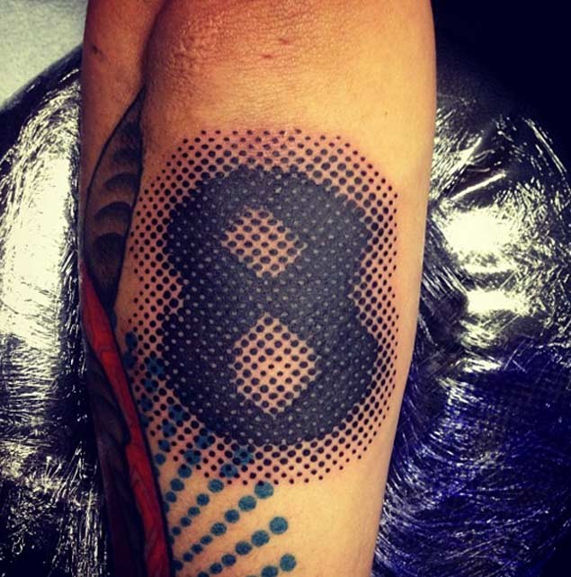 Stippling style black ink arm tattoo of 8 number