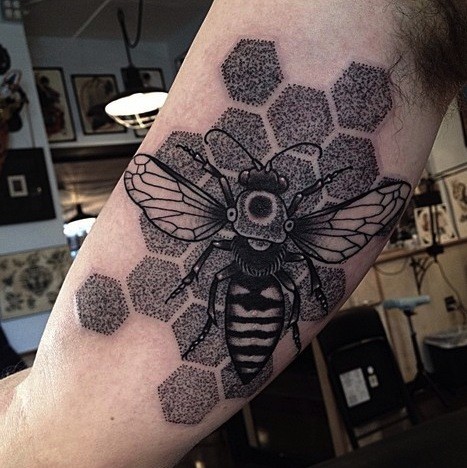 Stippling style black ink biceps tattoo of big bee with ornaments